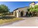 Exterior view of community building showcasing arches and green space at 23116 N Padaro Ct, Sun City West, AZ 85375