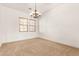 Spacious dining room featuring window with blinds at 23116 N Padaro Ct, Sun City West, AZ 85375