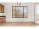 Bright dining area featuring neutral tile flooring, natural light, and ample space at 23116 N Padaro Ct, Sun City West, AZ 85375