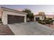 A spacious driveway leads to a well-maintained home with a convenient garage setup at 23116 N Padaro Ct, Sun City West, AZ 85375