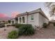 Exterior view of a charming home featuring stucco siding and lovely landscaping at 23116 N Padaro Ct, Sun City West, AZ 85375