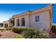 Residential home with a terracotta roof and stucco walls framed by manicured landscaping at 23116 N Padaro Ct, Sun City West, AZ 85375