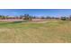 Golf course view showcases lush green fairway and manicured sand traps highlighting the beautiful landscaping around the community at 23116 N Padaro Ct, Sun City West, AZ 85375