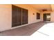 Covered patio featuring sliding glass doors, a ceiling fan, and concrete flooring at 23116 N Padaro Ct, Sun City West, AZ 85375