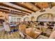 Elegant restaurant dining area with warm lighting, a mural, and ample seating for a comfortable dining experience at 23116 N Padaro Ct, Sun City West, AZ 85375