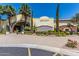 Elegant restaurant exterior with lush landscaping, a water feature, and inviting architectural design at 23116 N Padaro Ct, Sun City West, AZ 85375