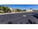 Exterior of community buildings from street view with lush landscaping, benches and decorative pathway at 23116 N Padaro Ct, Sun City West, AZ 85375