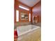 Bathroom features soaking tub with tile surround and backsplash, transom windows and towel hooks at 23731 S Angora Dr, Sun Lakes, AZ 85248