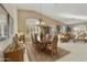 Elegant dining room with vintage chandelier, complementary area rug and ample natural light at 23731 S Angora Dr, Sun Lakes, AZ 85248