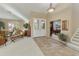 Grand foyer with tile flooring, double doors, neutral walls, and easy access to the living room and staircase at 23731 S Angora Dr, Sun Lakes, AZ 85248