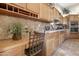 Cozy kitchen workspace featuring custom cabinets, built-in desk and stylish tile backsplash at 23731 S Angora Dr, Sun Lakes, AZ 85248