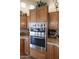 Modern kitchen with stainless steel double ovens and tiled backsplash, a chef's dream! at 23731 S Angora Dr, Sun Lakes, AZ 85248