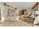 Cozy living room with tile floors, natural light, a ceiling fan, built in cabinets, and a neutral color palette at 23731 S Angora Dr, Sun Lakes, AZ 85248