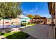 Pool area with an outdoor kitchen, offering the perfect blend of relaxation and entertainment at 2422 W Aloe Vera Dr, Phoenix, AZ 85085