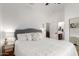 Bright bedroom with a queen-sized bed, ensuite bathroom, and a walk-in closet at 2422 W Aloe Vera Dr, Phoenix, AZ 85085