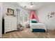 Bright bedroom with a twin bed, a white wardrobe, and a cute pink canopy at 2422 W Aloe Vera Dr, Phoenix, AZ 85085