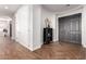 Inviting entryway with wood-look flooring and a black cabinet at 2422 W Aloe Vera Dr, Phoenix, AZ 85085