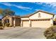 Charming single-story home featuring a three-car garage and desert landscaping at 2422 W Aloe Vera Dr, Phoenix, AZ 85085