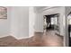 Hallway leading to office space featuring wood-look herringbone floors at 2422 W Aloe Vera Dr, Phoenix, AZ 85085