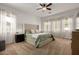 Spacious main bedroom with natural light, ceiling fan, neutral color palette at 2422 W Aloe Vera Dr, Phoenix, AZ 85085