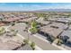 An aerial view displays a well-planned neighborhood with single-Gathering homes, lush landscaping, and scenic streets at 24670 N 171St Ln, Surprise, AZ 85387