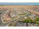 Aerial view of a well-planned community with diverse home styles and desert landscaping at 24670 N 171St Ln, Surprise, AZ 85387