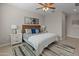 Cozy bedroom featuring a wicker headboard, ceiling fan, and neutral decor at 24670 N 171St Ln, Surprise, AZ 85387