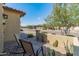 Inviting front porch with two chairs and views of the neighborhood, desert landscaping at 24670 N 171St Ln, Surprise, AZ 85387