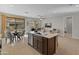 Bright kitchen island with stainless steel sink and modern appliances in an open floor plan at 24670 N 171St Ln, Surprise, AZ 85387