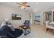 Comfortable living room featuring tile floors, modern furniture, and a ceiling fan at 24670 N 171St Ln, Surprise, AZ 85387