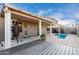 Outdoor living with an outdoor kitchen, putting green and pool at 2528 E La Costa Dr, Chandler, AZ 85249