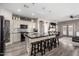 Contemporary kitchen with a stone-accented island, modern backsplash, and open layout, ideal for cooking and social interaction at 2528 E La Costa Dr, Chandler, AZ 85249