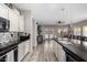 Modern kitchen features a large island and opens up to the living area, creating an inclusive and communal space at 2528 E La Costa Dr, Chandler, AZ 85249