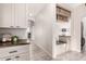 Bright mud room features storage with drawers, cabinets, bench, hooks and baskets at 2528 E La Costa Dr, Chandler, AZ 85249