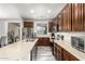 Spacious kitchen featuring a lengthy countertop, stainless steel appliances, and wood-style cabinetry at 2645 W Florentine Rd, Phoenix, AZ 85086