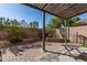 Outdoor patio featuring a pergola, brick pavers, and landscaped garden beds for tranquil outdoor living at 2645 W Florentine Rd, Phoenix, AZ 85086