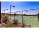 Well-maintained community tennis courts surrounded by desert landscape and greenery at 2645 W Florentine Rd, Phoenix, AZ 85086