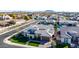 Aerial view of a home with a gray tile roof, landscaping, pool and a three-car garage at 2799 E Waterman St, Gilbert, AZ 85297