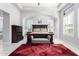 Stylish bedroom featuring a patterned rug, bench seating, and abundant natural light from large windows at 2799 E Waterman St, Gilbert, AZ 85297