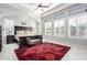 Bright bedroom boasts a large window, a ceiling fan, and a decorative flower patterned rug at 2799 E Waterman St, Gilbert, AZ 85297