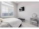 Bright bedroom with a window and shutters, and a gray vanity and tufted bench at 2799 E Waterman St, Gilbert, AZ 85297