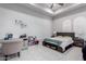 Bedroom with ceiling fan, desk, and bed featuring built-in storage underneath at 2799 E Waterman St, Gilbert, AZ 85297