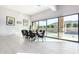 Bright dining area with tile floors and views of the pool and outdoor kitchen at 2799 E Waterman St, Gilbert, AZ 85297