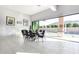 Bright dining area with tile floors and views of the pool and outdoor kitchen at 2799 E Waterman St, Gilbert, AZ 85297