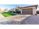 One story stone home with two car garage and well manicured landscaping at 2799 E Waterman St, Gilbert, AZ 85297