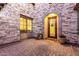 Charming front porch with stone accents, potted plants, and an elegant front door with a decorative grille at 2799 E Waterman St, Gilbert, AZ 85297