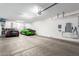 Wide angle view of garage, showing the cars parked inside and the garage door opener at 2799 E Waterman St, Gilbert, AZ 85297