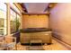 Backyard featuring a hot tub in a covered patio area at 2799 E Waterman St, Gilbert, AZ 85297