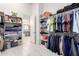 A well-organized walk-in closet with shelving provides plenty of storage, with an ensuite bathroom view at 2799 E Waterman St, Gilbert, AZ 85297