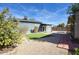 This backyard offers a private outdoor space complete with artificial turf and a gravel area at 2902 E Escondido Ave, Mesa, AZ 85204